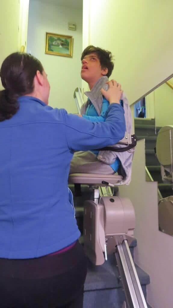 patient on stairlift
