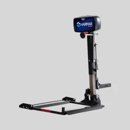 A Harmar vehicle lift for mobility devices is pictured against a plain background. The device has a black frame with a vertical lifting mechanism and a branded label at the top.