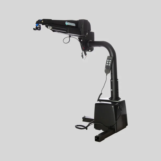 A black hydraulic crane with a digital control panel, mounted on a stable base, designed for lifting heavy objects.
