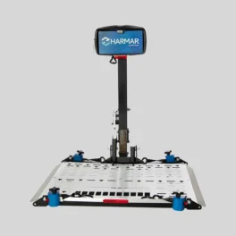 A motorized wheelchair lift by Harmar with a platform and a vertical support column mounted on a grey background.