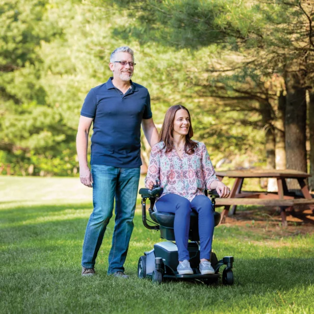 a person on a pride go chair power scooter.