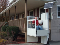a patient using a SHC vertical platform lift.