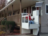 a patient using a SHC vertical platform lift.