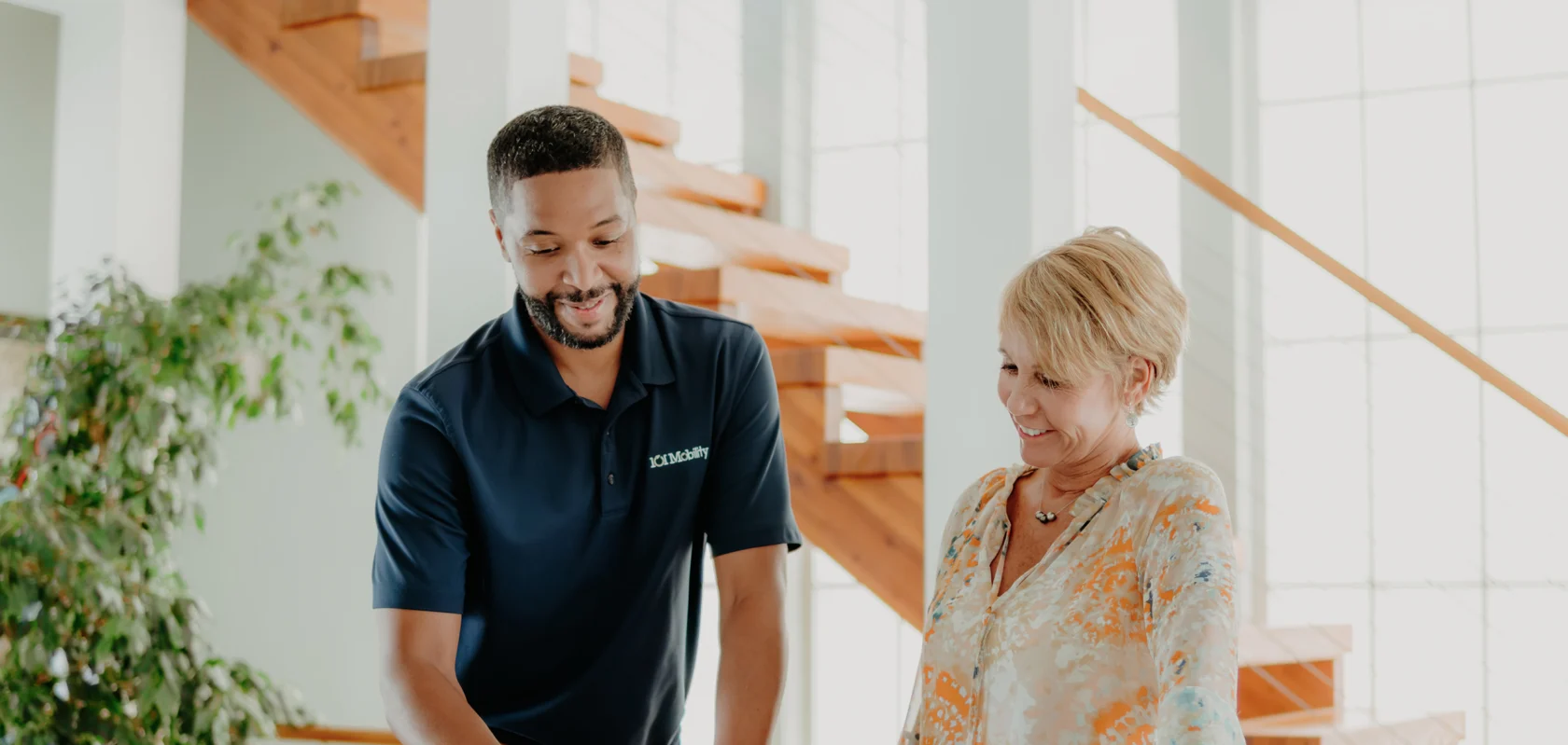a 101 mobility staff member doing an in-home consultation for a client.