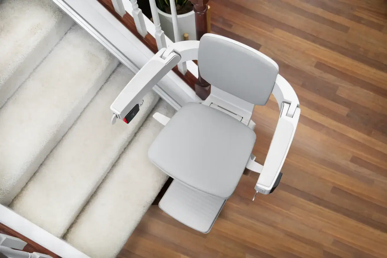 Overhead view of the Bruno Elan SRE-5000 stairlift seat, armrests and footrest