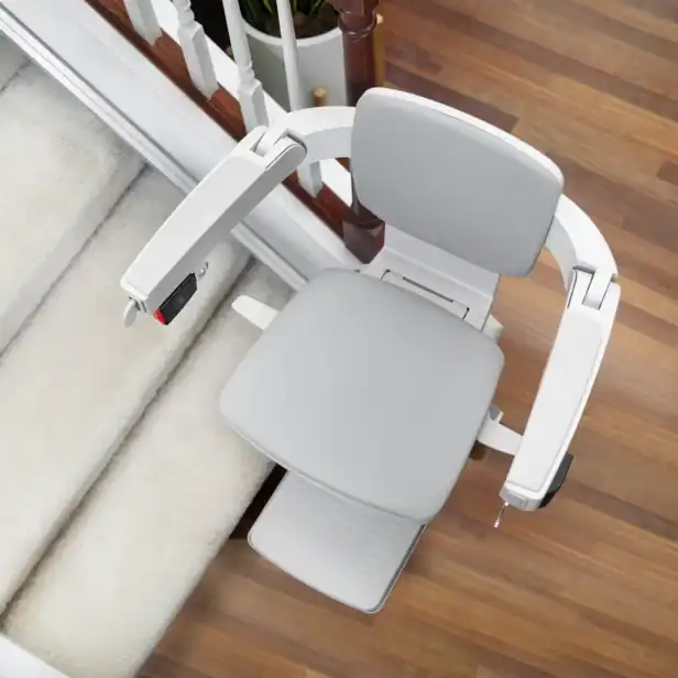 Overhead view of the Bruno Elan SRE-5000 stairlift seat, armrests and footrest