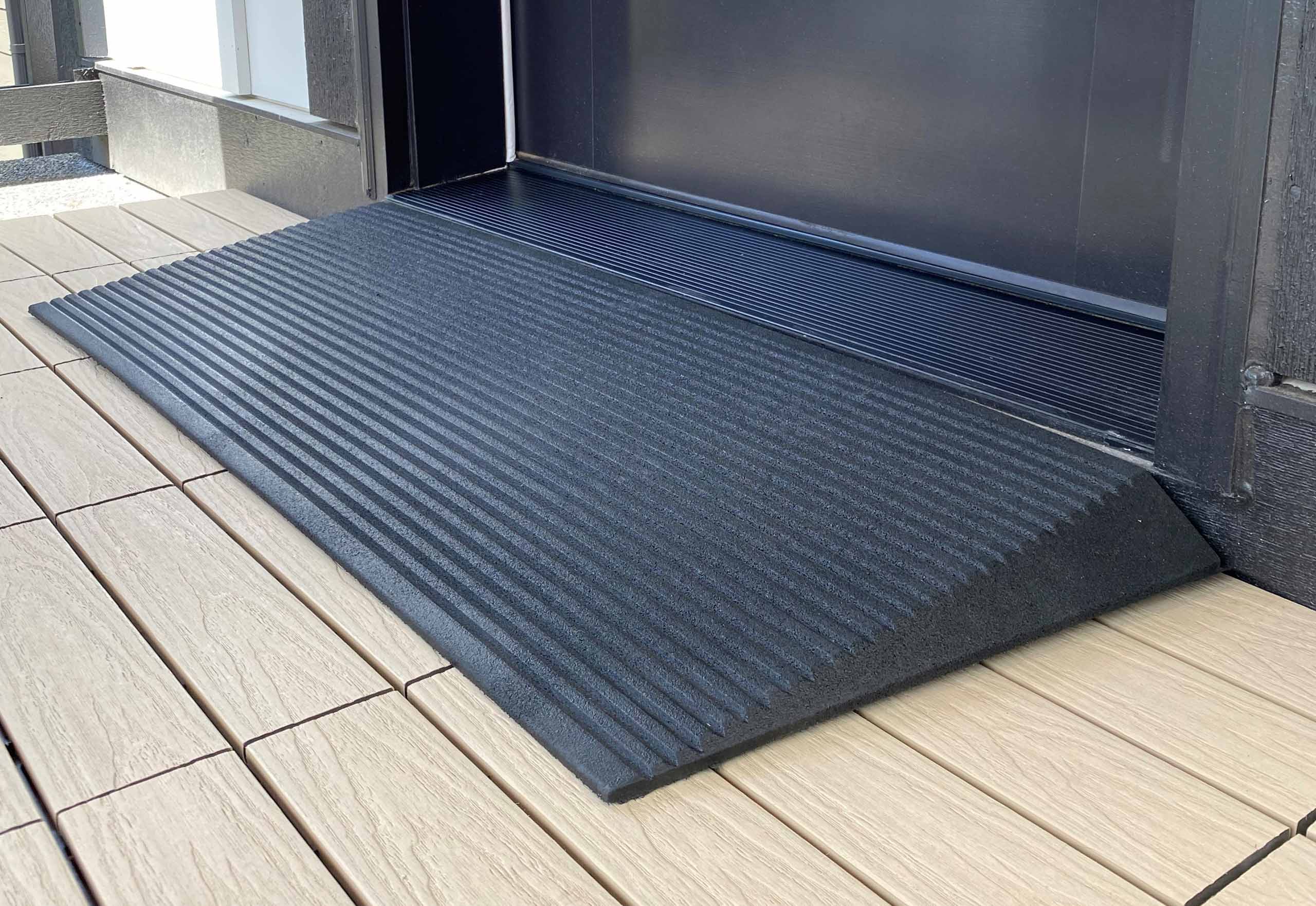 a close up view of a rubber threshold ramp.