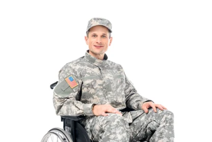 smiling military man in wheelchair isolated on white.