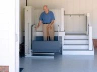 a man using a bruno vertical platform lift.