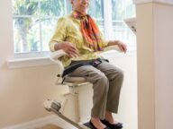 a person sitting on a harmar SL300.