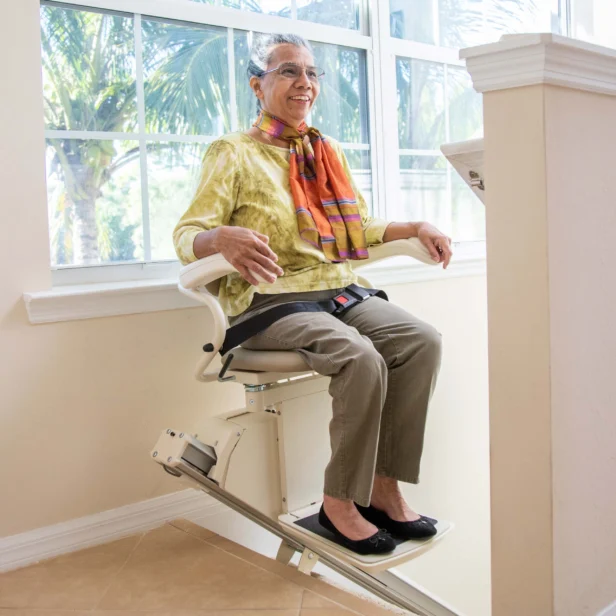 a person sitting on a harmar SL300.