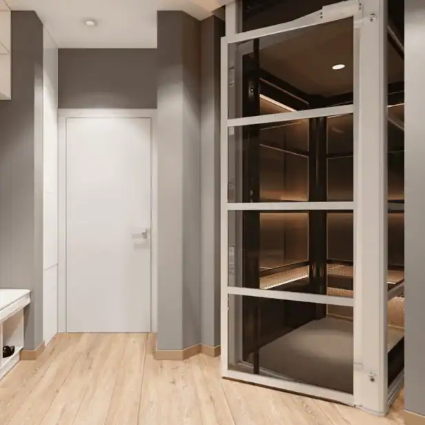 A modern indoor residential elevator with glass doors is next to a white closed door in a room with wood flooring and gray walls.