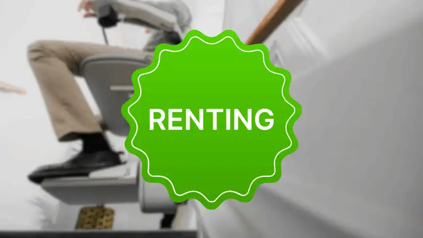 A person uses a stairlift on a staircase, with a bright green badge in the center displaying the word "RENTING.