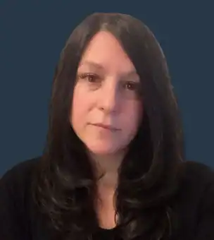 A woman with long, straight dark hair and a neutral expression is shown against a plain dark blue background. She is wearing a black top.