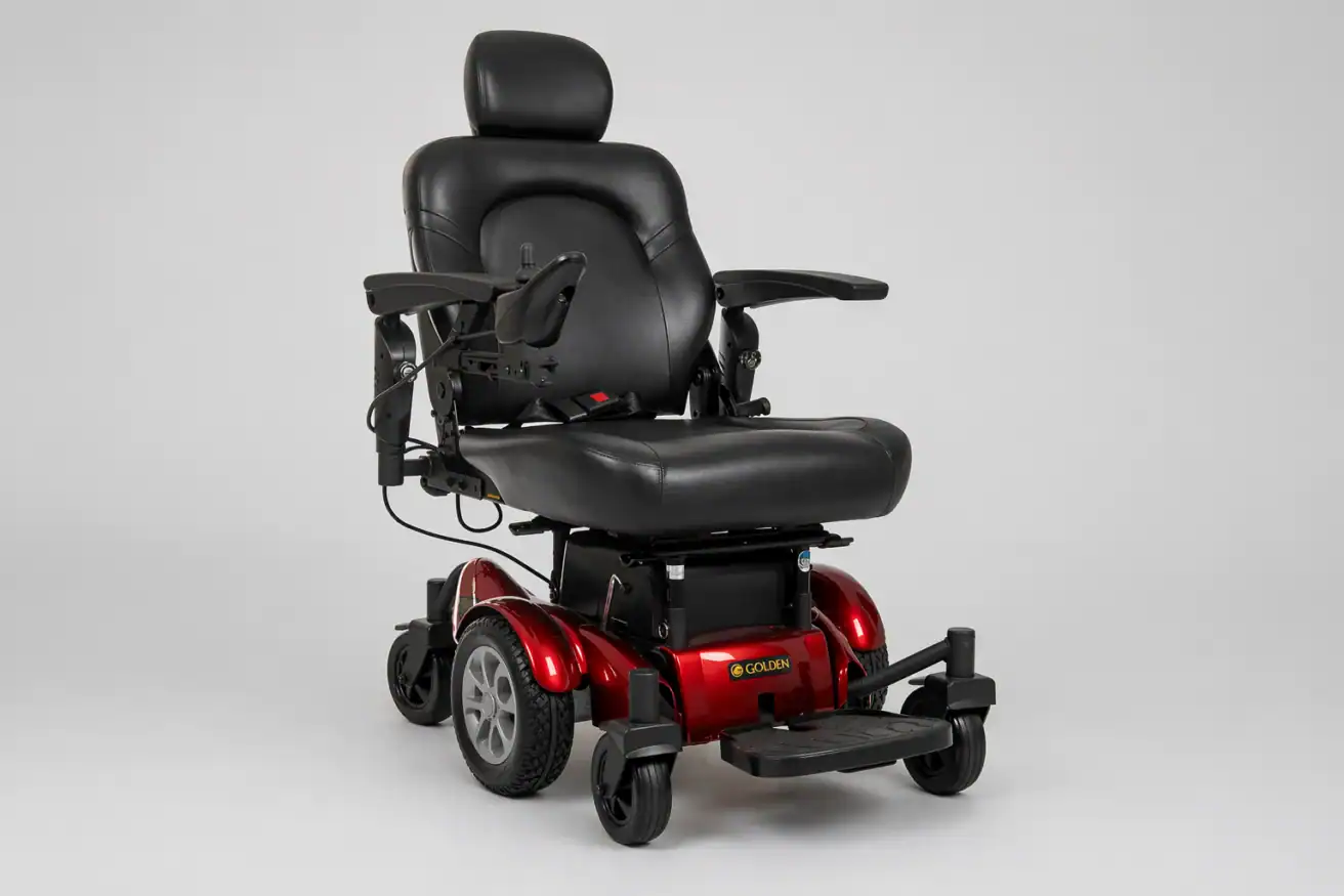 A black and red electric power wheelchair with padded seat, armrests, footrest, and four wheels, shown against a plain light background.