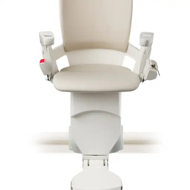 Front view of a beige and white motorized stair lift chair with armrests, mounted on a straight rail track, isolated on a white background.