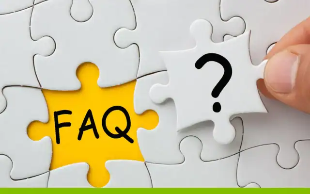 A hand holds a puzzle piece with a question mark to fit into a gap labeled “FAQ” in a white and yellow jigsaw puzzle.