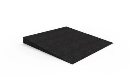 Black rubber wedge-shaped ramp with a textured surface, shown on a white background. The ramp has a gradual incline and notched underside.