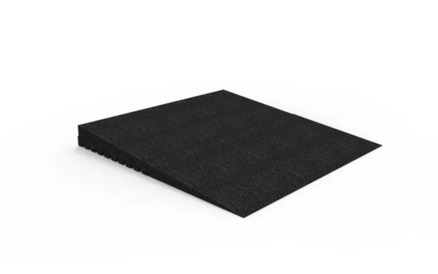 Black rubber wedge-shaped ramp with a textured surface, shown on a white background. The ramp has a gradual incline and notched underside.