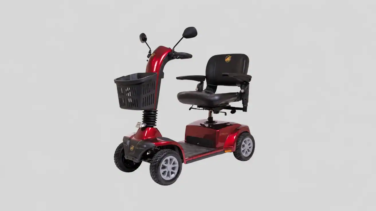 A red four-wheel mobility scooter with a black seat, basket on the front, armrests, rearview mirrors, and handlebars, shown against a plain gray background.