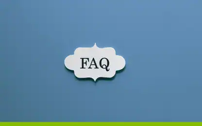 A white, decorative speech bubble containing the text “FAQ” centered on a blue background.