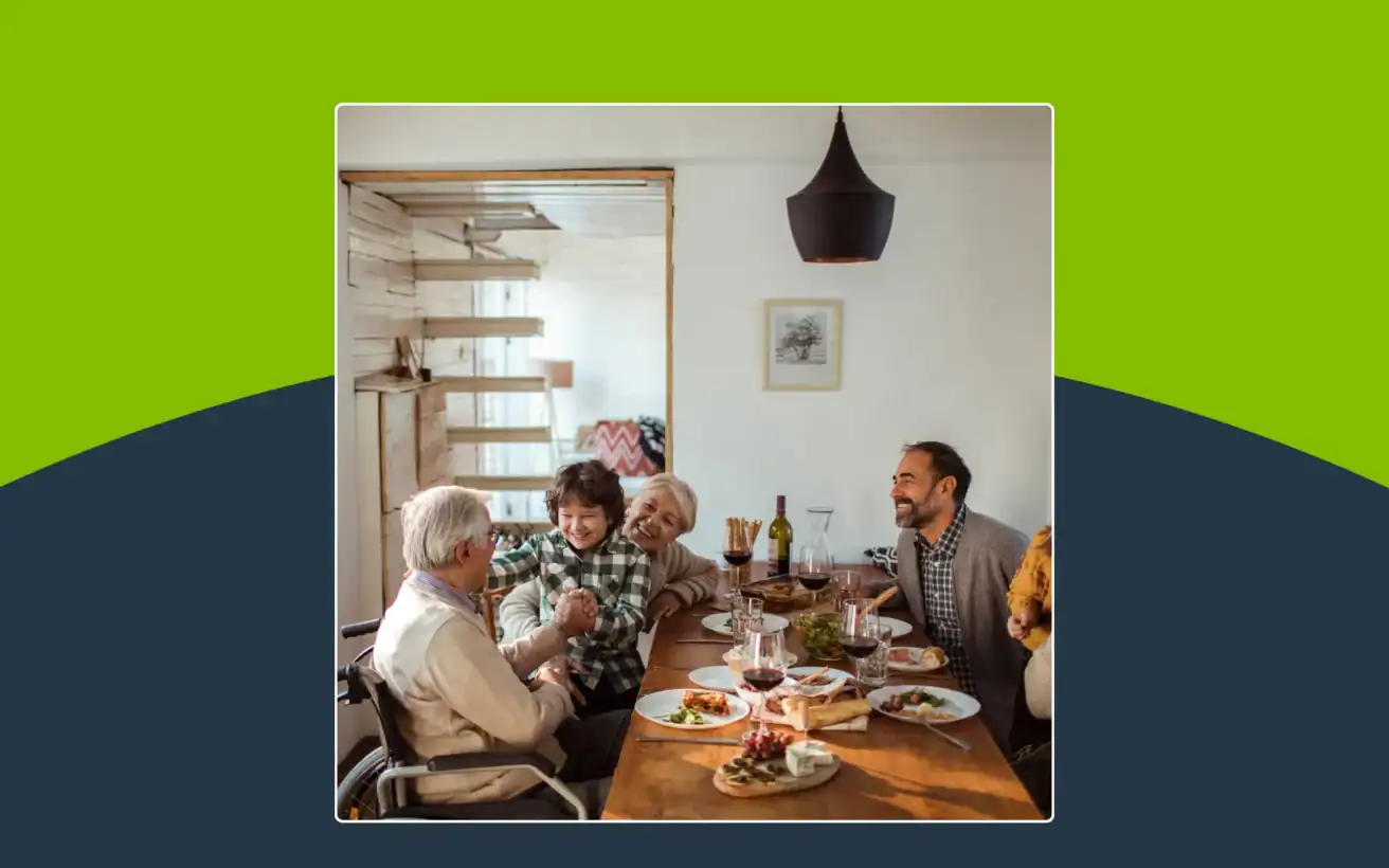 A multi-generational family eating dinner together at a dining table.