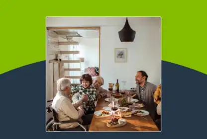 A multi-generational family eating dinner together at a dining table.